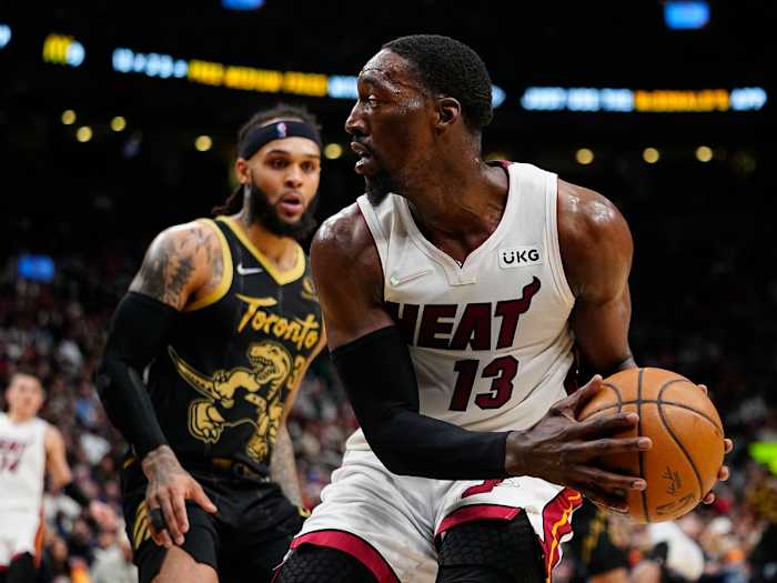 Apr 3, 2022; Toronto, Ontario, CAN; Miami Heat center Bam Adebayo (13) looks to pass the ball as Toronto Raptors guard Gary Trent Jr. (33) defends during the first half at Scotiabank Arena. Mandatory Credit: John E. Sokolowski-USA TODAY Sports